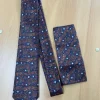 Bruinblauwe stropdas met patroon