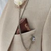 Gebroken wit corsage bruidegom