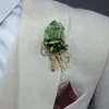 Groen corsage bruidegom