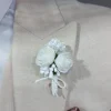 Wit corsage bruidegom